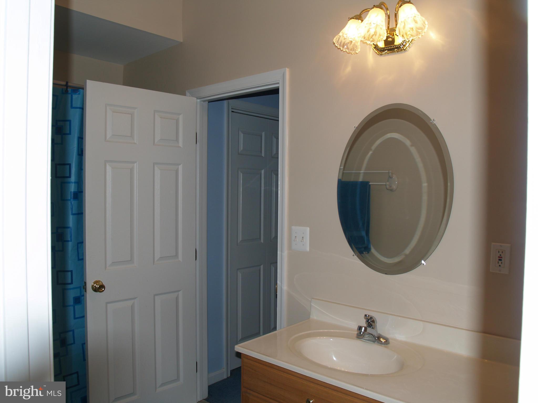 92 Friendship Road Friendship, MD 20758 - Photo 18 of 27 a bathroom with a sink and a mirror