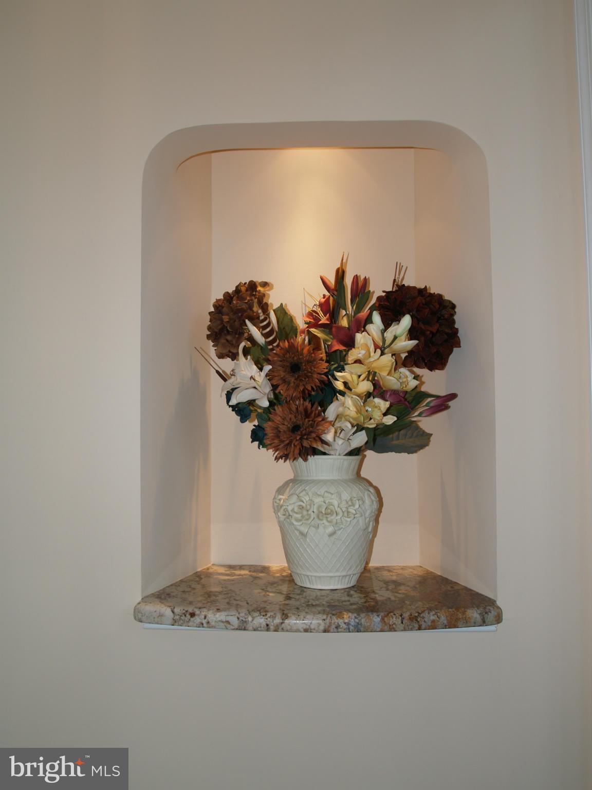 92 Friendship Road Friendship, MD 20758 - Photo 19 of 27 a white vase with white and yellow flowers