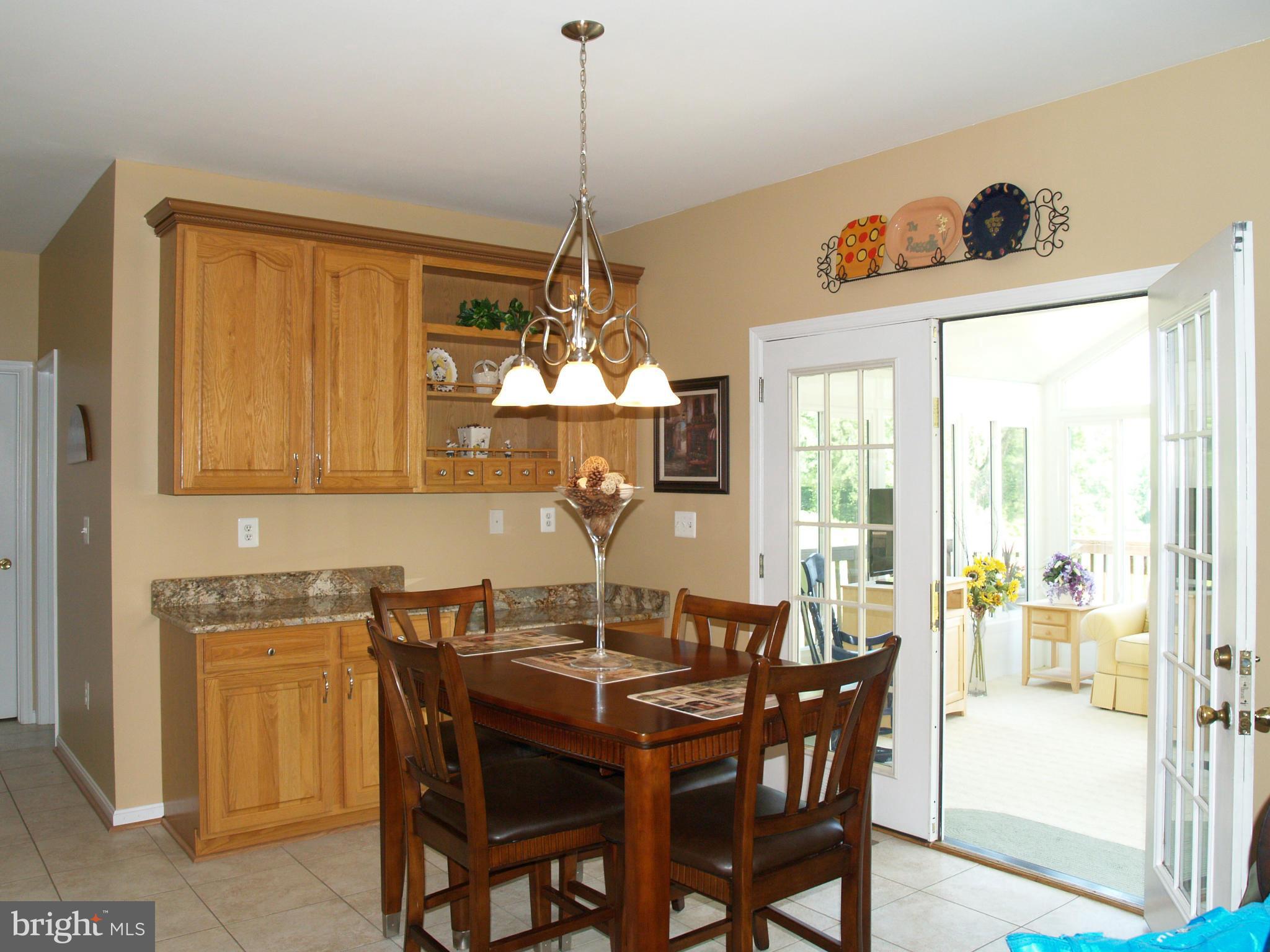 92 Friendship Road Friendship, MD 20758 - Photo 3 of 27 a view of a dining room with furniture window and wooden floor