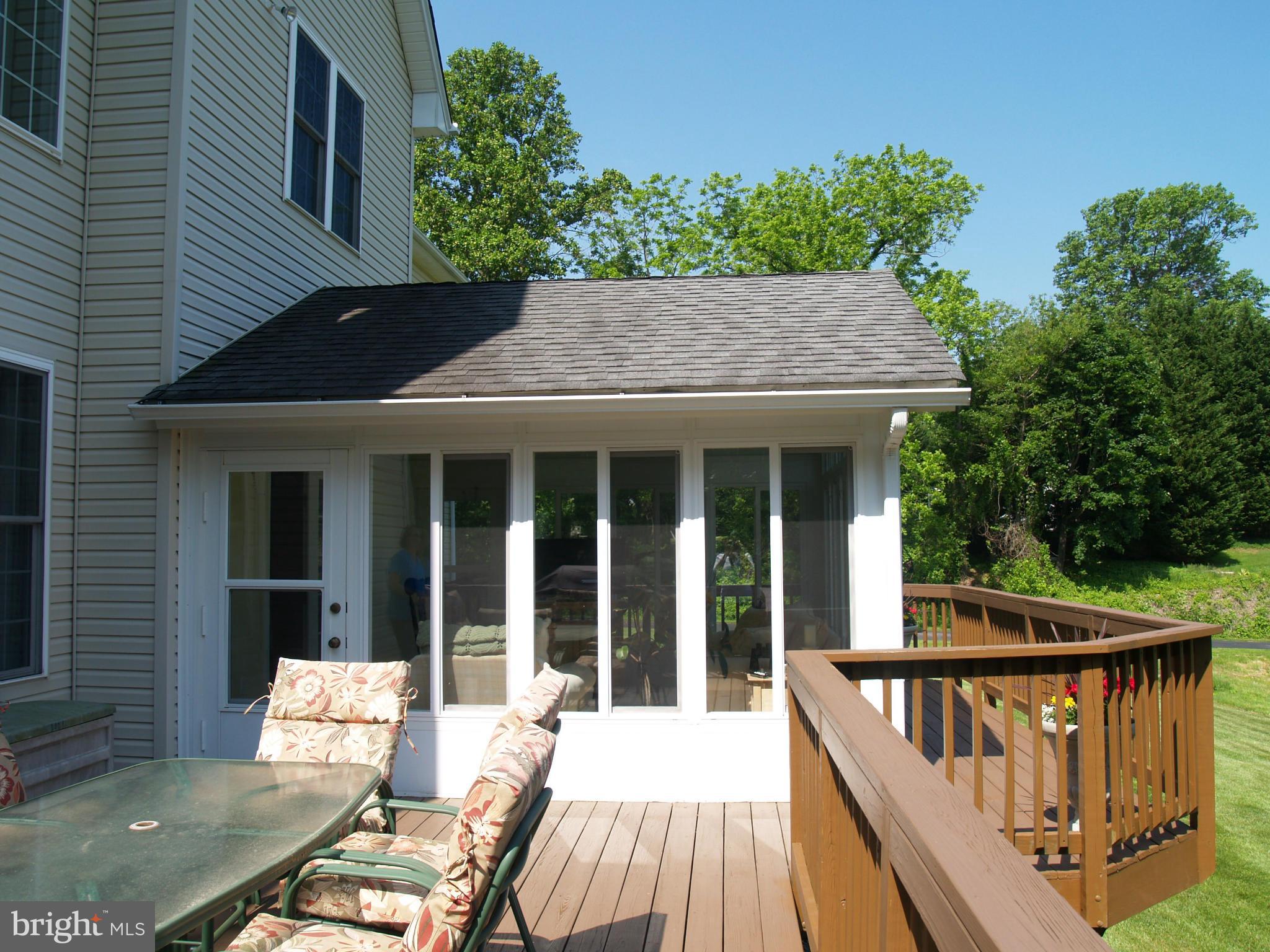 92 Friendship Road Friendship, MD 20758 - Photo 24 of 27 a balcony with table and chairs