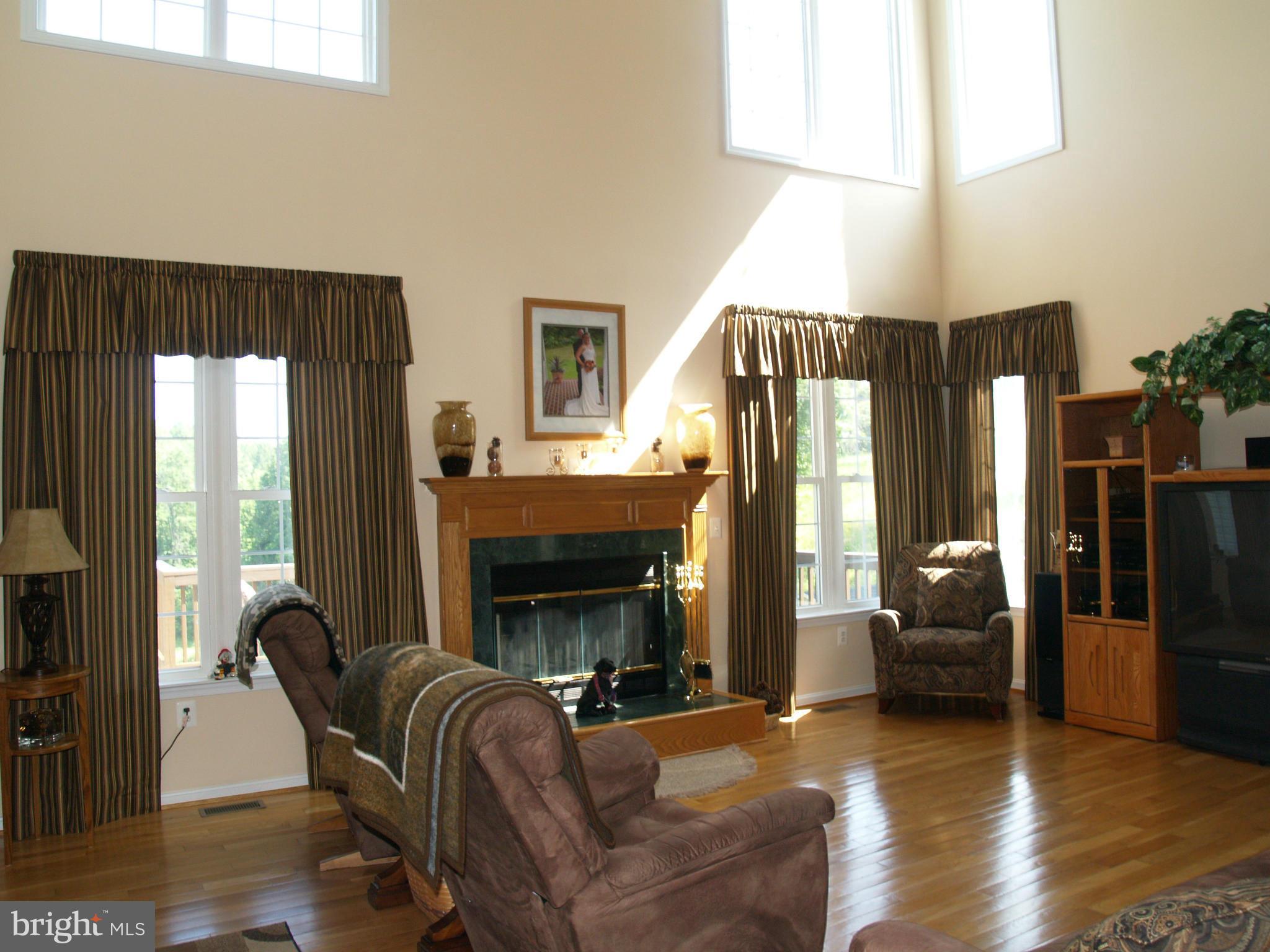 92 Friendship Road Friendship, MD 20758 - Photo 6 of 27 a living room with furniture and a fireplace