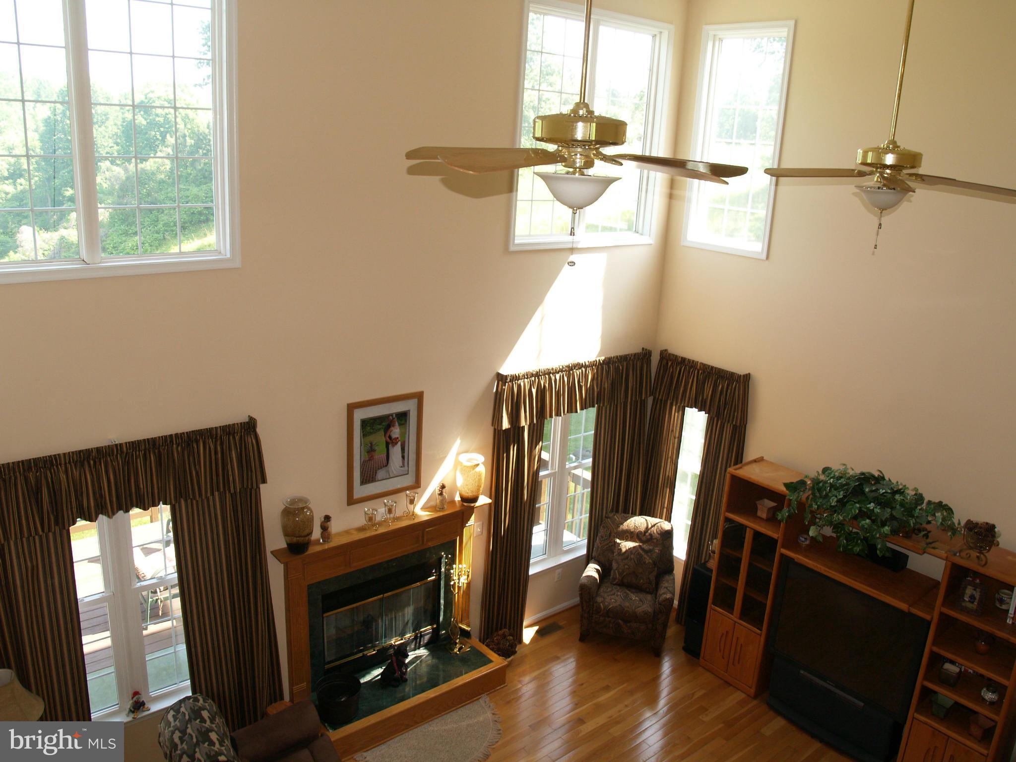 92 Friendship Road Friendship, MD 20758 - Photo 8 of 27 a living room with furniture and a fireplace