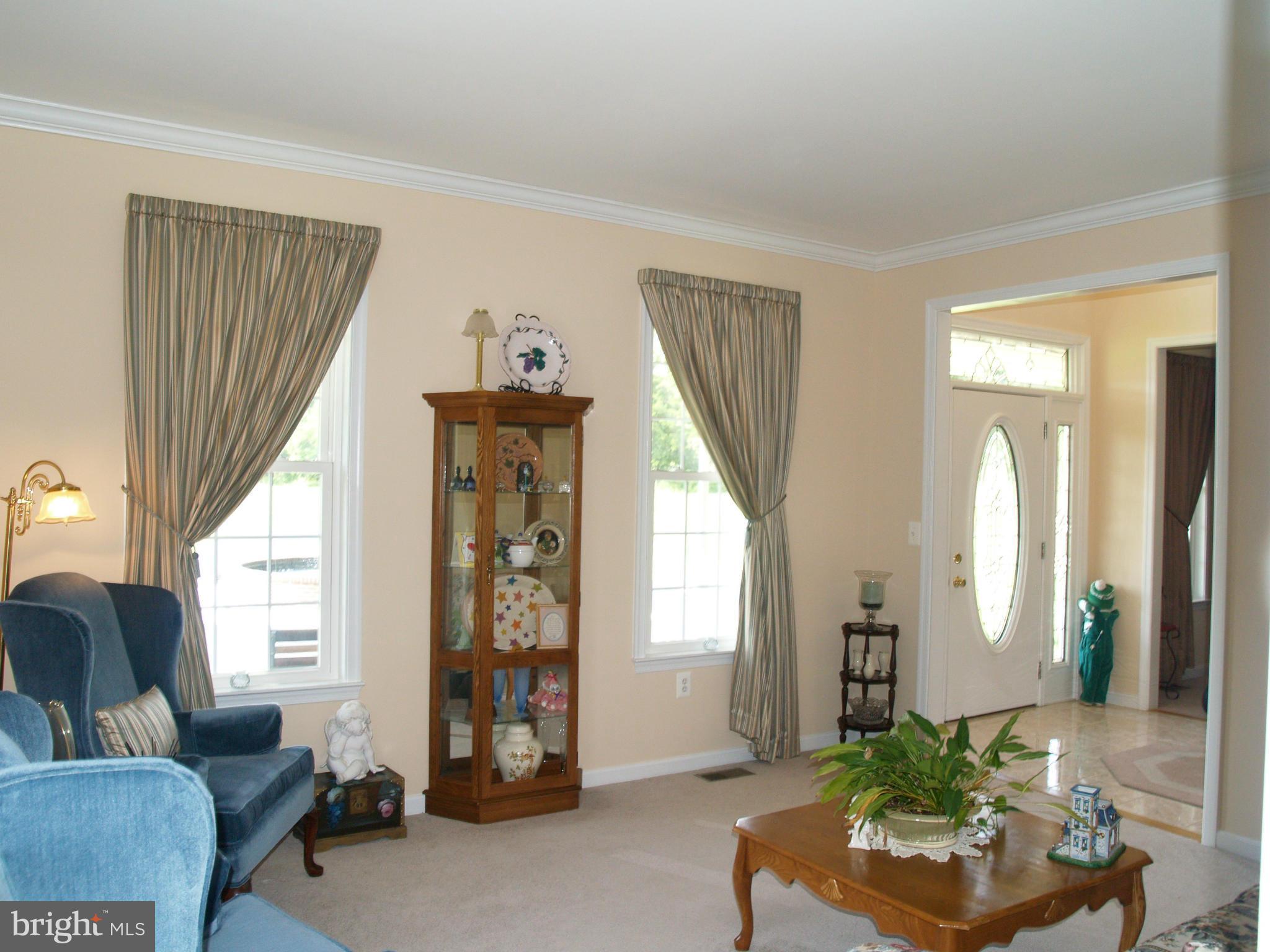 92 Friendship Road Friendship, MD 20758 - Photo 9 of 27 a living room with furniture and a large window