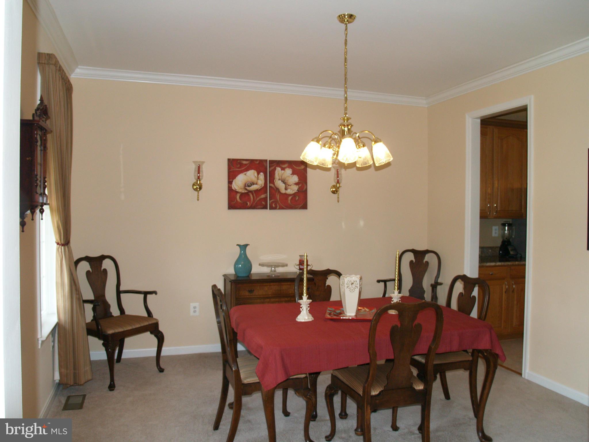 92 Friendship Road Friendship, MD 20758 - Photo 10 of 27 a view of a dining room with furniture and chandelier