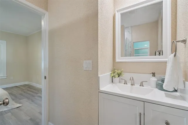 a bathroom with a sink and a mirror