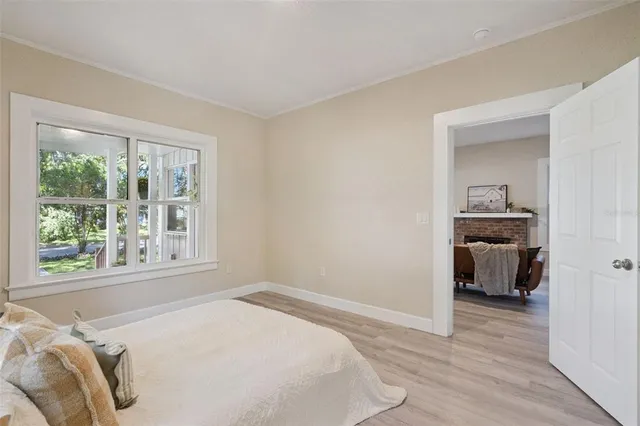 a bedroom with a bed and a window