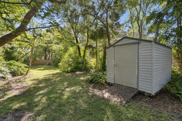 a backyard of a house with lots of green space