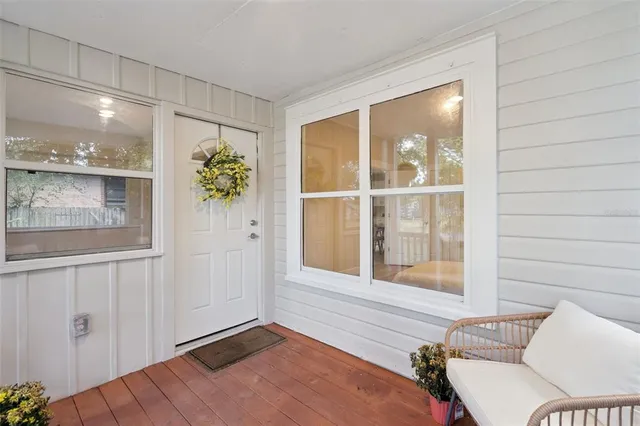 a view of a bedroom with furniture and windows