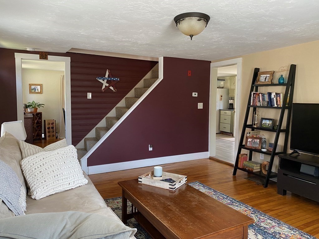 1315 Barre Road Hardwick, MA 01037 - Photo 28 of 38 a living room with furniture and wooden floor
