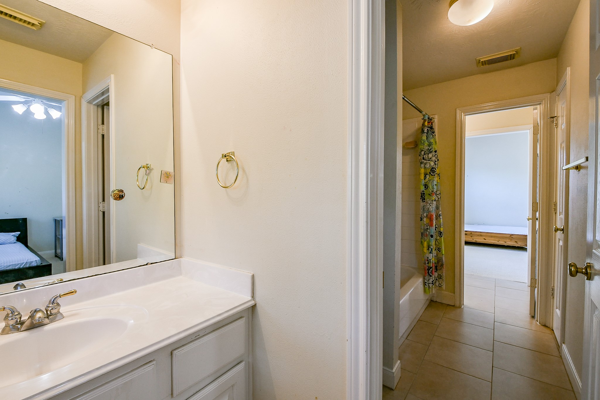 12023 Bolero Point Lane Houston, TX 77041 - Photo 26 of 32 a en suite bathroom with a sink and a mirror