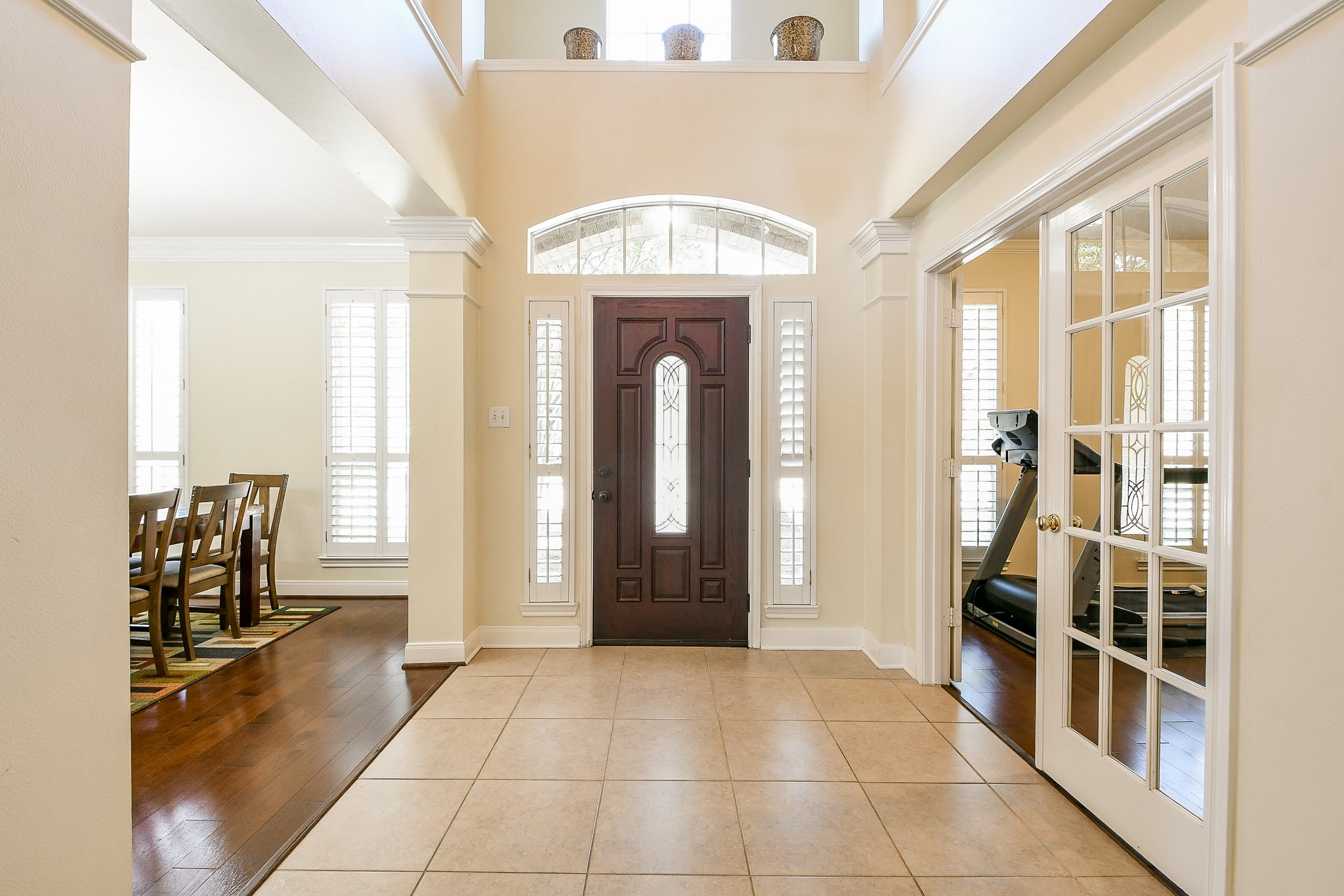 12023 Bolero Point Lane Houston, TX 77041 - Photo 6 of 32 a view of a hallway with wooden floor and windows