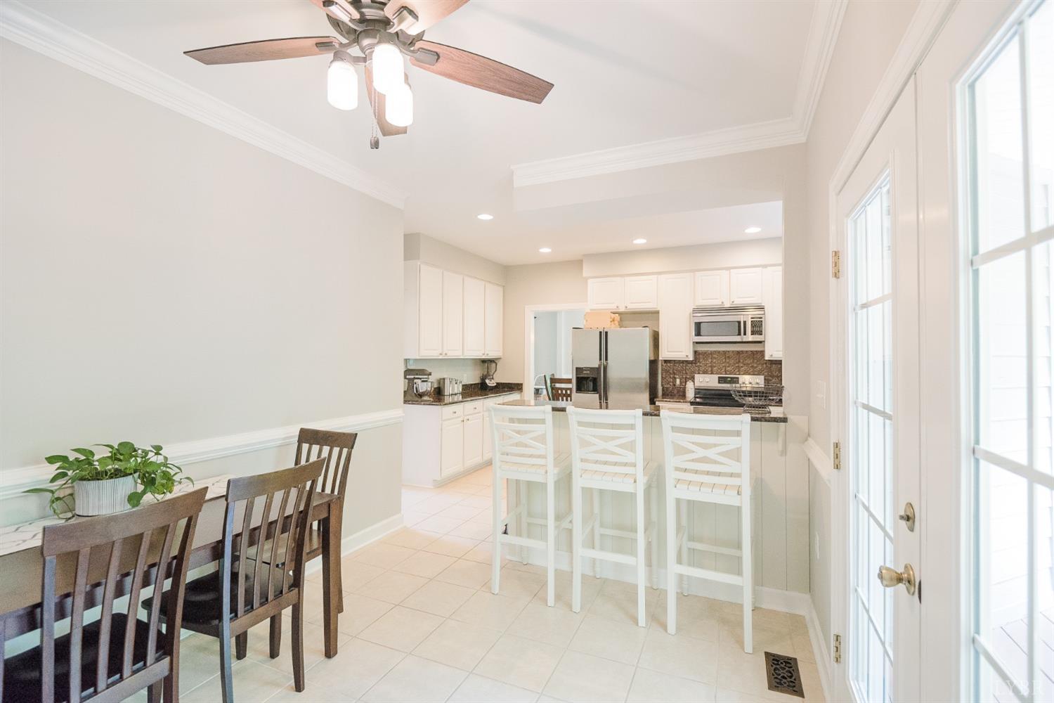 96 Quarry Road Farmville, VA 23901 - Photo 14 of 72 a view of a dining room with furniture and a chandelier fan