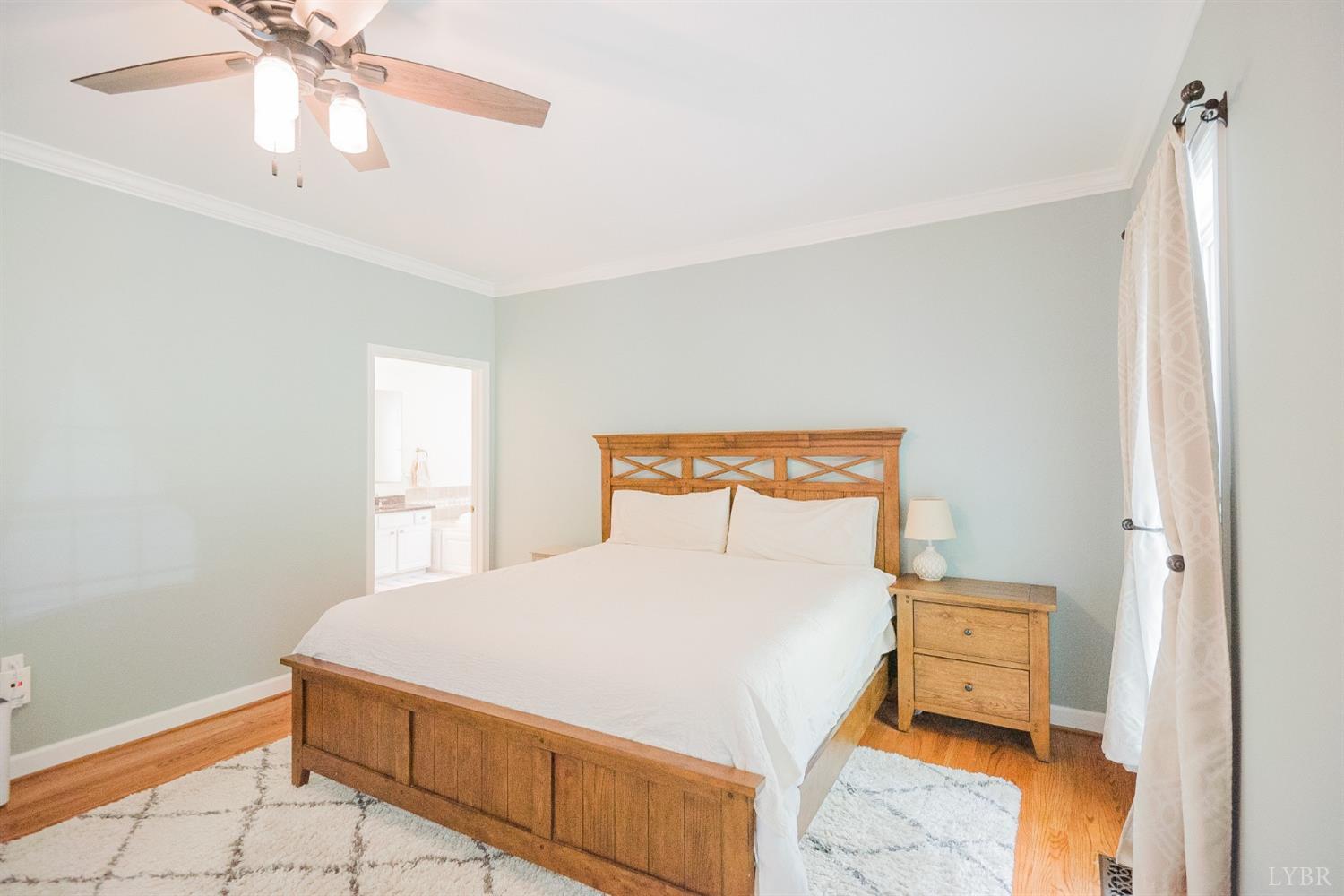 96 Quarry Road Farmville, VA 23901 - Photo 20 of 72 a bedroom with a bed and a chandelier