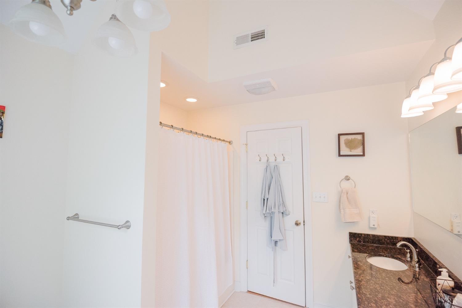 96 Quarry Road Farmville, VA 23901 - Photo 32 of 72 a bathroom with a shower sink and mirror