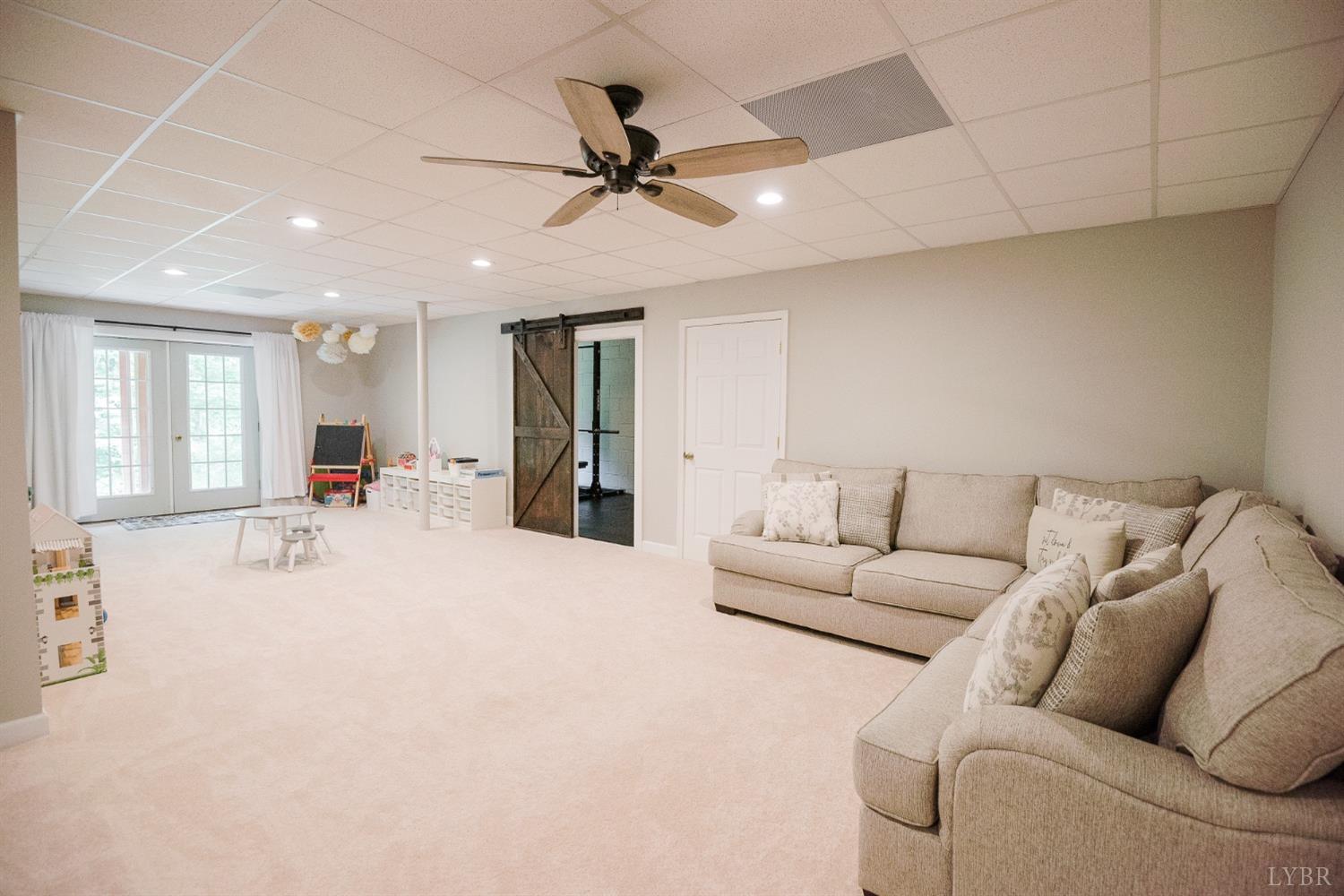 96 Quarry Road Farmville, VA 23901 - Photo 41 of 72 a living room with furniture and a chandelier