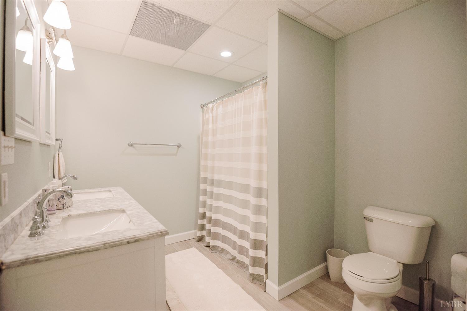96 Quarry Road Farmville, VA 23901 - Photo 49 of 72 a bathroom with a granite countertop sink toilet and shower