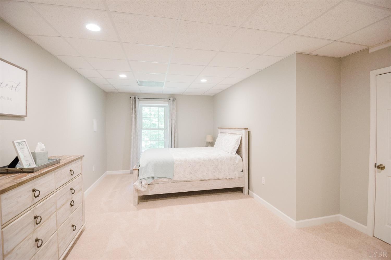 96 Quarry Road Farmville, VA 23901 - Photo 51 of 72 a spacious bedroom with a bed and a dresser