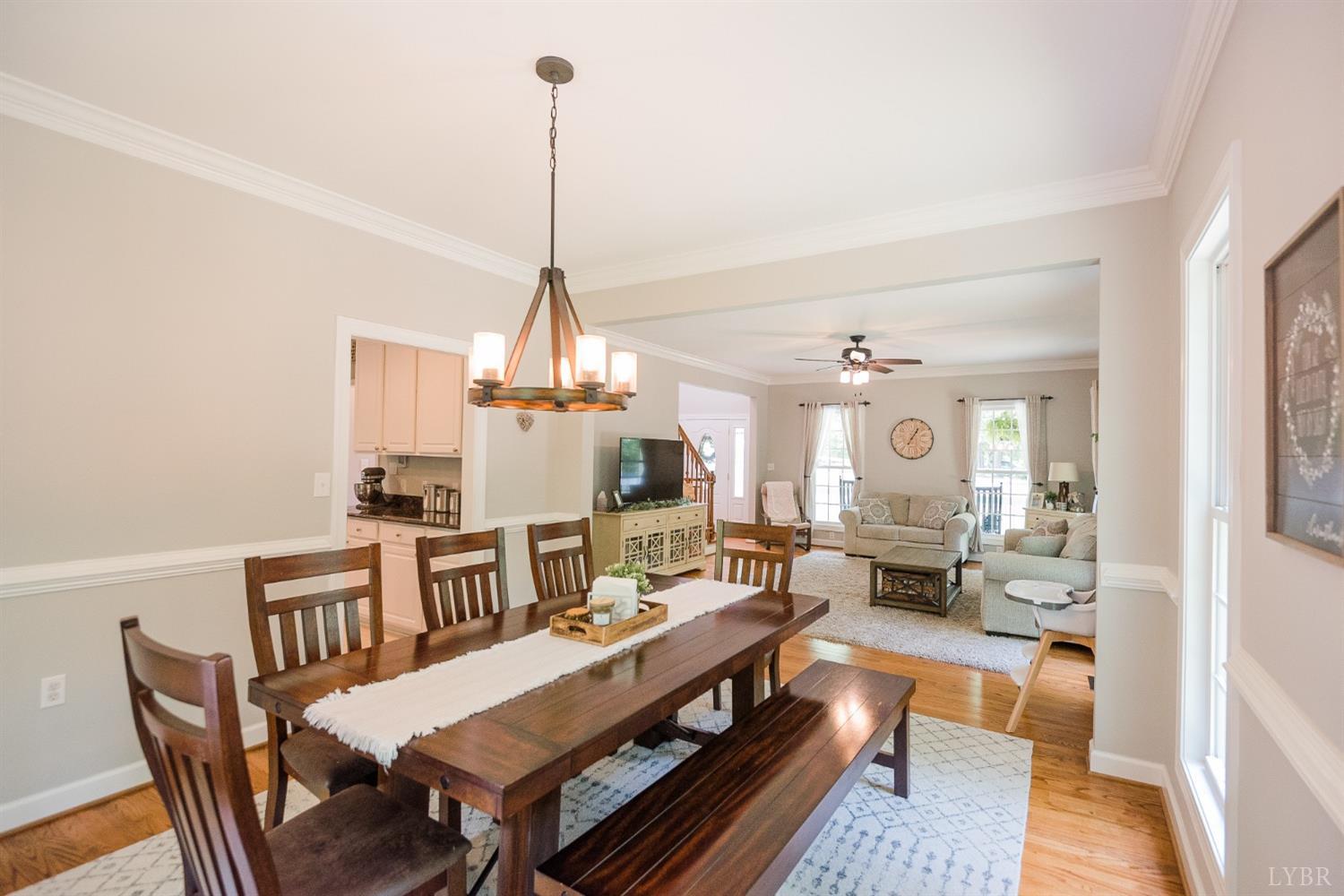 96 Quarry Road Farmville, VA 23901 - Photo 8 of 72 a living room with furniture a chandelier and a dining table