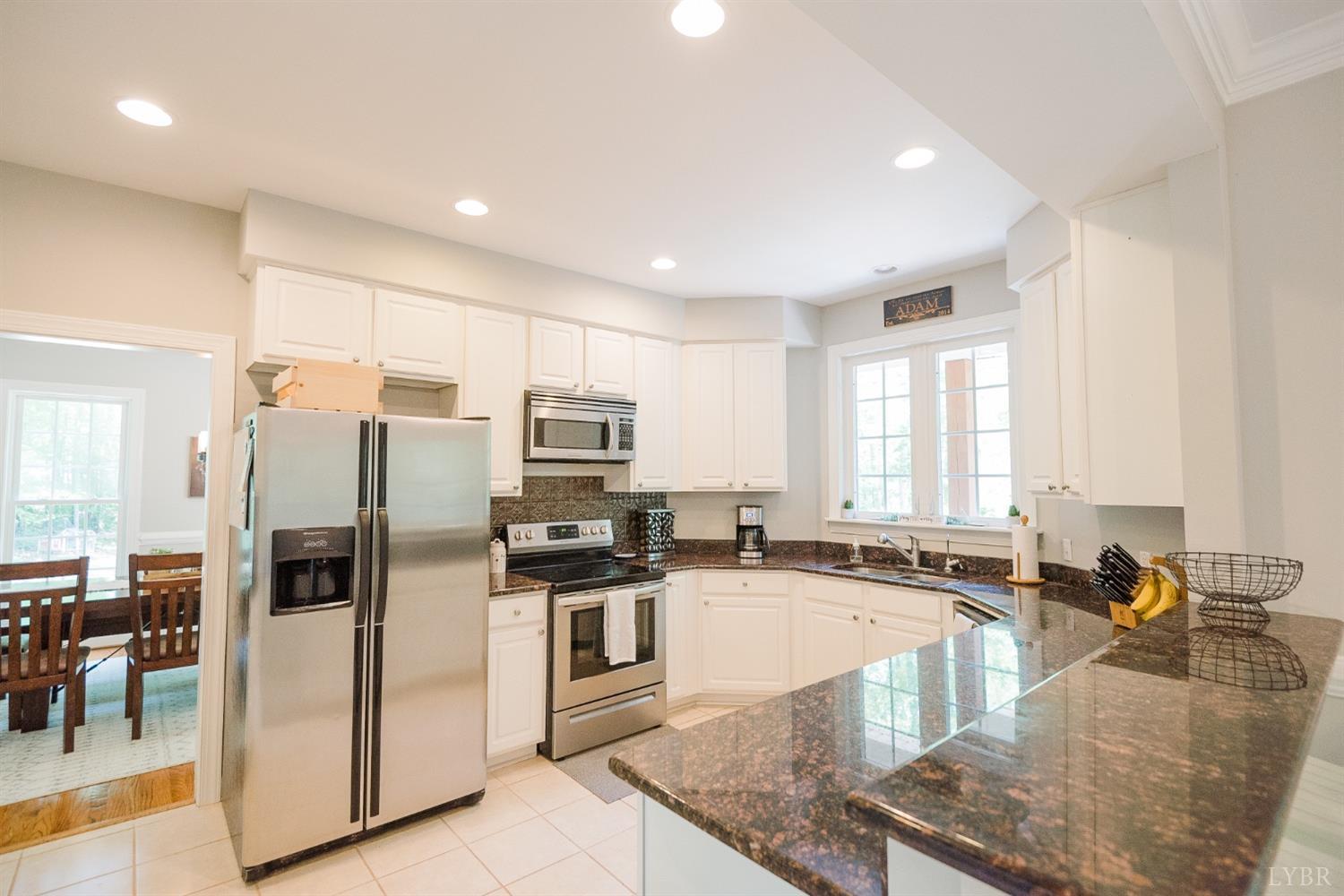 96 Quarry Road Farmville, VA 23901 - Photo 10 of 72 a kitchen with stainless steel appliances granite countertop a sink a stove and a refrigerator