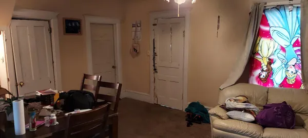 a kitchen with a refrigerator and a stove