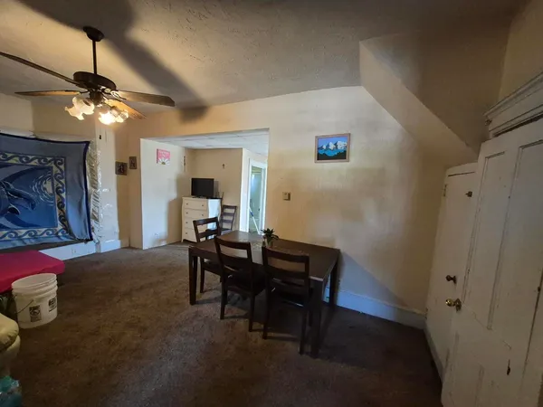 a kitchen with a refrigerator and a stove