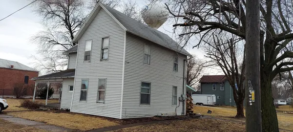 a view of a house with a tree