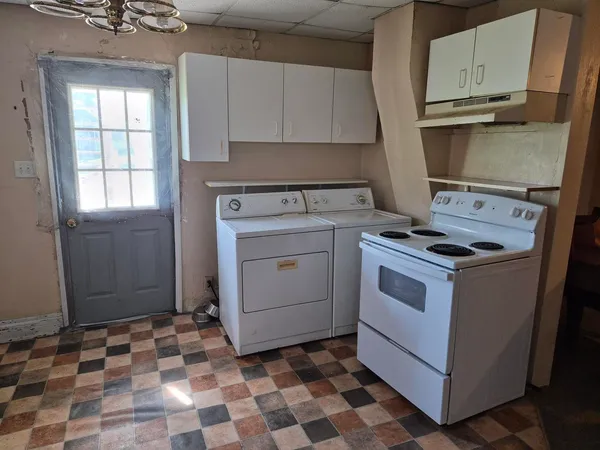 a kitchen with a refrigerator and a sink