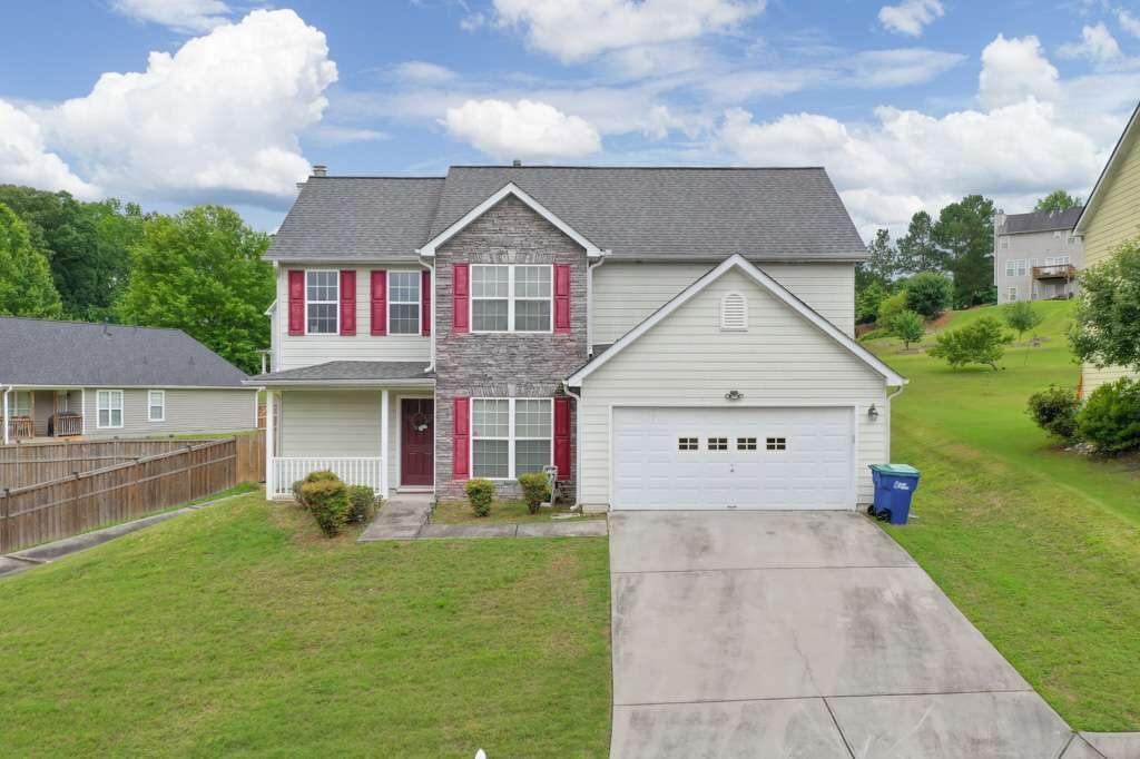7668 Overlook Bend Fairburn, GA 30213 - Photo 1 of 1 a front view of house with yard and green space