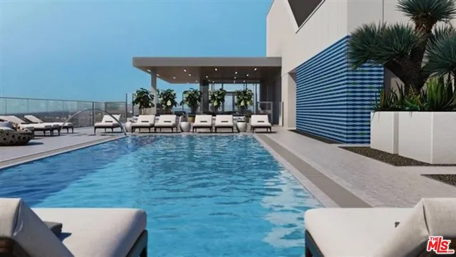 a view of a backyard with sitting area