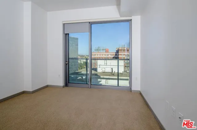 a view of empty room with floor to ceiling window