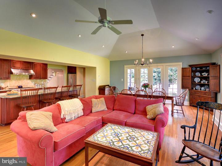 630 Moreno Road Narberth, PA 19072 - Photo 8 of 22 a living room with furniture kitchen view and a chandelier