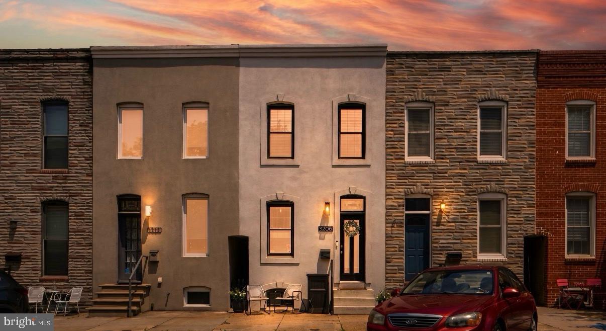 3208 Elliott Street Baltimore, MD 21224 - Photo 2 of 42 a front view of a building with parking