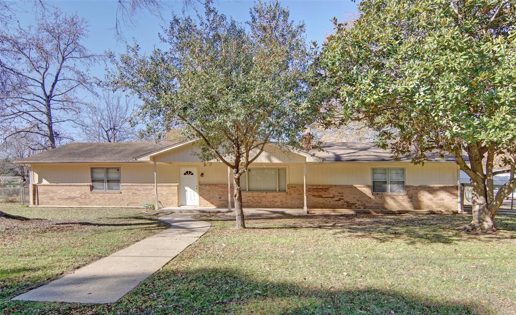 a house with trees in the background