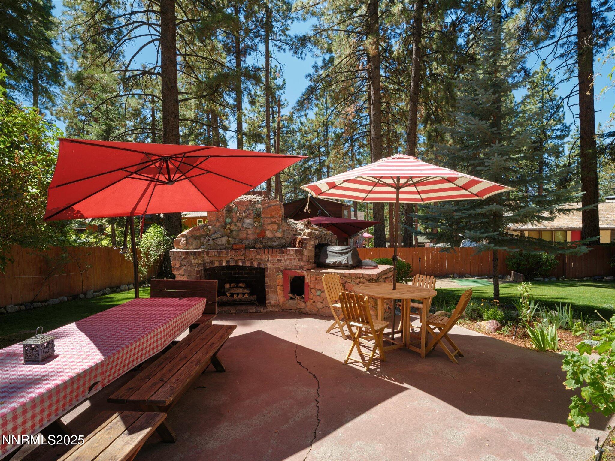 644 Job Lane Zephyr Cove, NV 89448 - Photo 22 of 26 a view of a patio with chairs and a umbrella