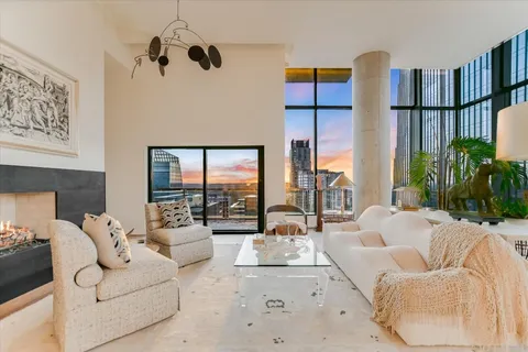 a living room with furniture or couch and a large window