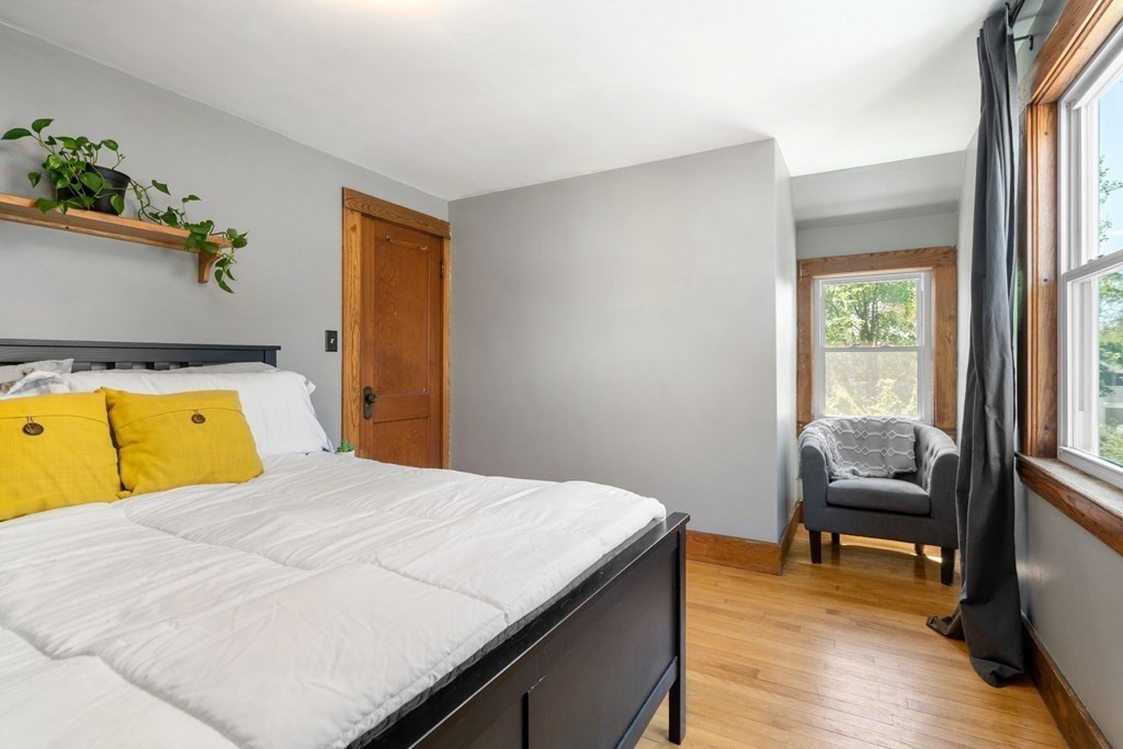 8 Lindbergh Road Framingham, MA 01702 - Photo 14 of 25 a bedroom with a bed and wooden floor