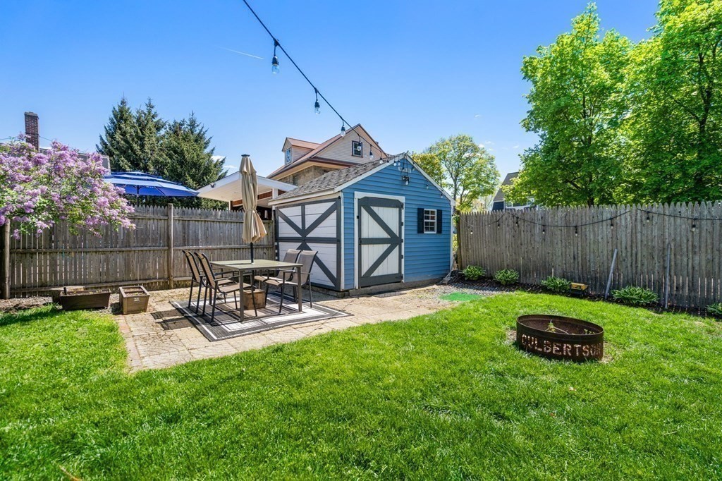 8 Lindbergh Road Framingham, MA 01702 - Photo 23 of 25 a view of a chair and table in backyard of the house