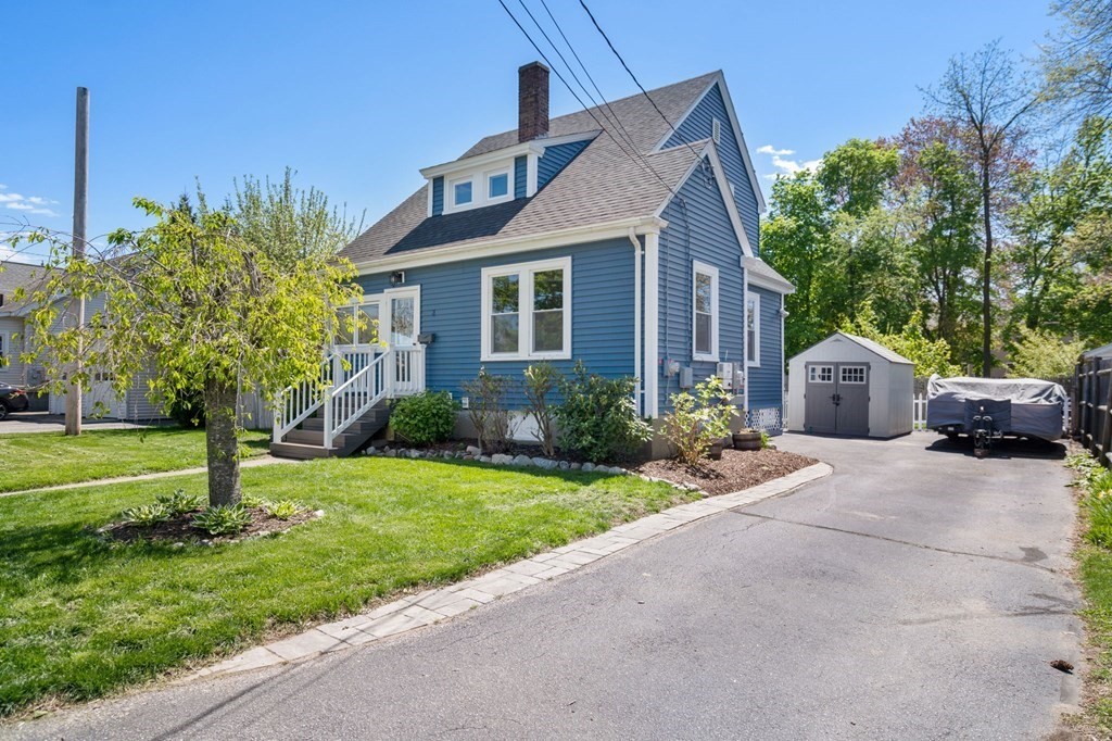 8 Lindbergh Road Framingham, MA 01702 - Photo 3 of 25 a front view of a house with garden