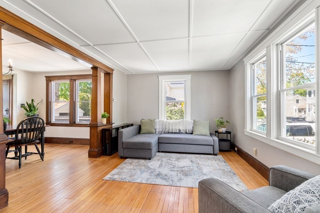 8 Lindbergh Road Framingham, MA 01702 - Photo 4 of 25 a living room with furniture and a large window