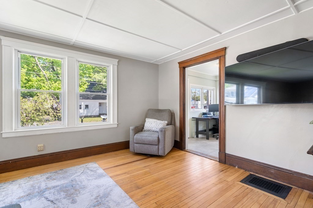 8 Lindbergh Road Framingham, MA 01702 - Photo 6 of 25 a living room with furniture and a large window