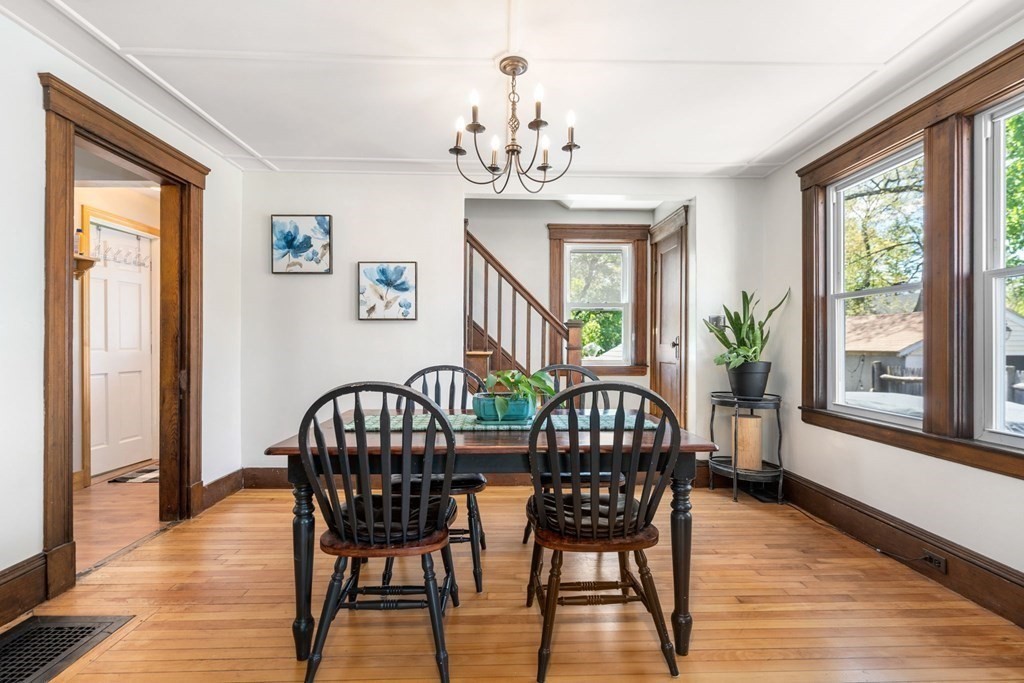 8 Lindbergh Road Framingham, MA 01702 - Photo 8 of 25 a view of a dining room with furniture a chandelier and wooden floor