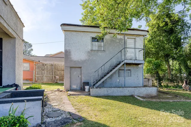 a view of a livingroom with furniture and a flat screen tv