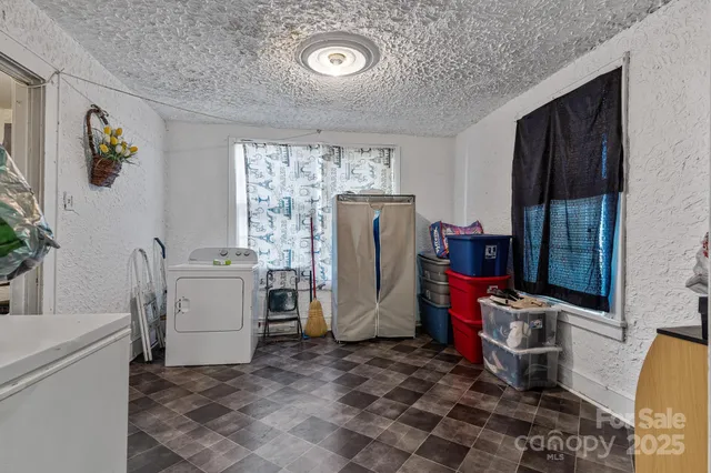 a kitchen with a stove a sink and a refrigerator