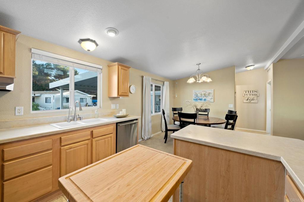 9100 Single Oak Drive, Unit 26 Lakeside, CA 92040 - Photo 20 of 46 a kitchen with a sink a counter top space and appliances