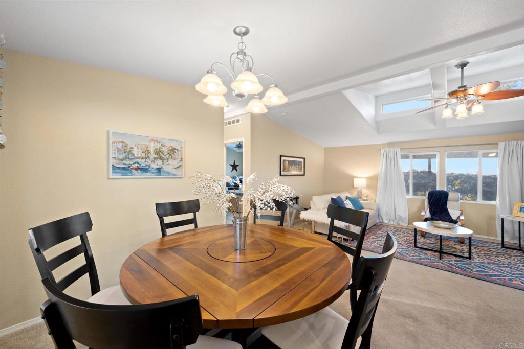 9100 Single Oak Drive, Unit 26 Lakeside, CA 92040 - Photo 22 of 46 a view of a dining room with furniture and chandelier