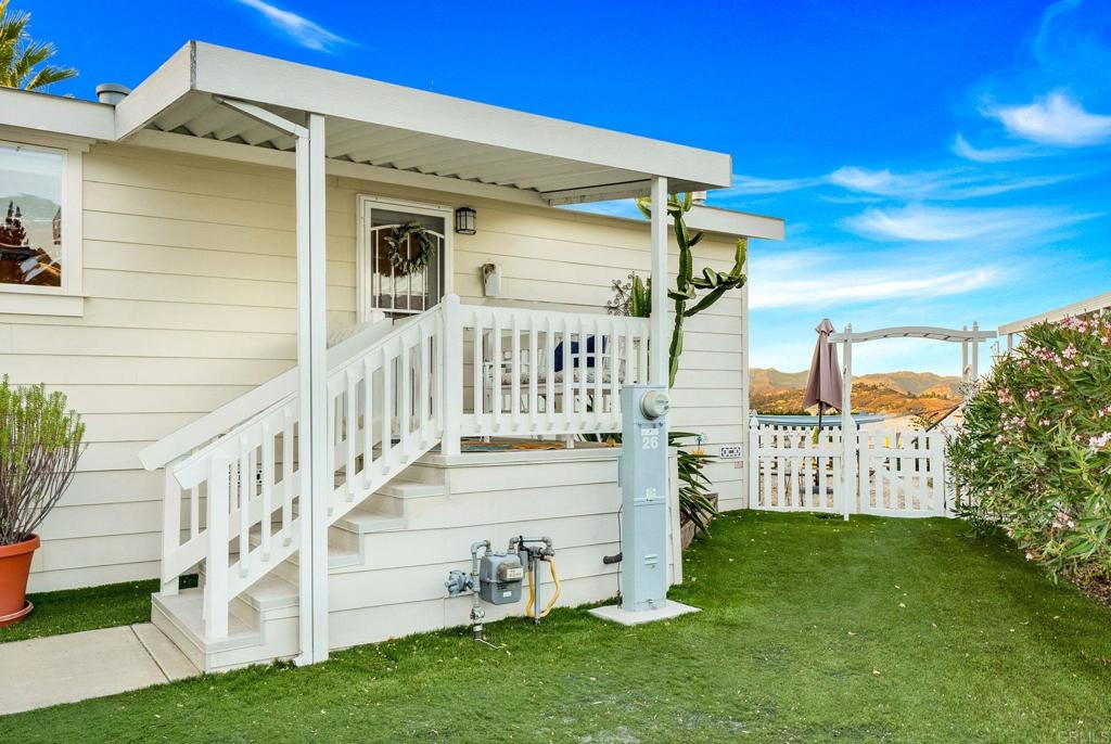 9100 Single Oak Drive, Unit 26 Lakeside, CA 92040 - Photo 31 of 46 a view of a house with a yard with flower plants