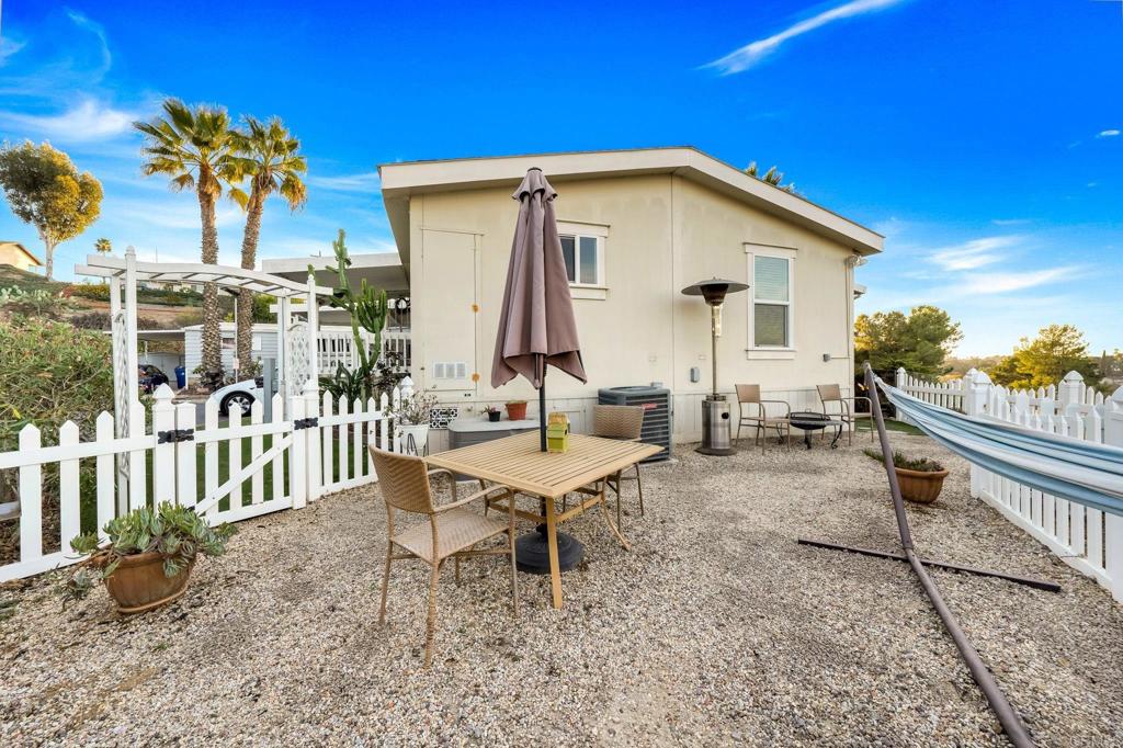 9100 Single Oak Drive, Unit 26 Lakeside, CA 92040 - Photo 33 of 46 a view of a terrace with couches and wooden fence