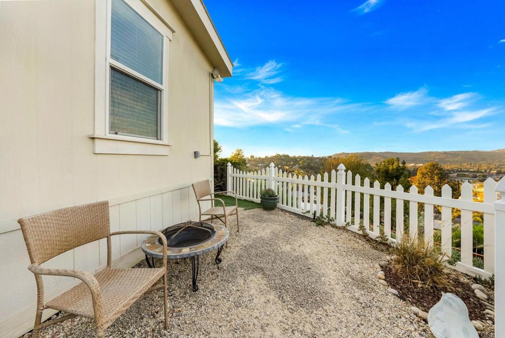 9100 Single Oak Drive, Unit 26 Lakeside, CA 92040 - Photo 35 of 46 a view of a chair and tables in the balcony