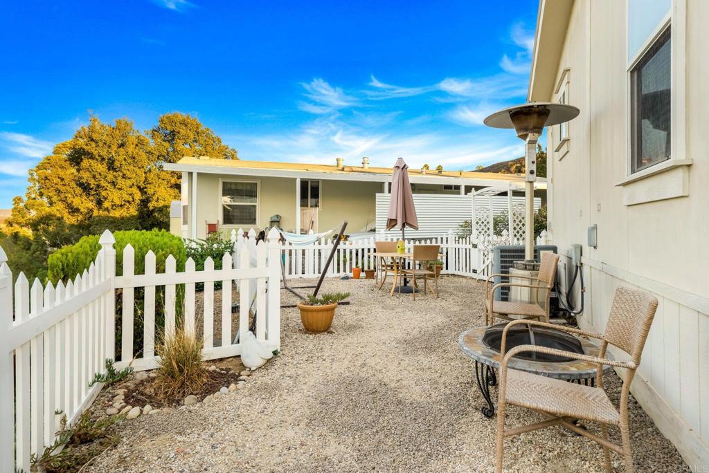9100 Single Oak Drive, Unit 26 Lakeside, CA 92040 - Photo 44 of 46 a view of a chair and tables in the patio yard