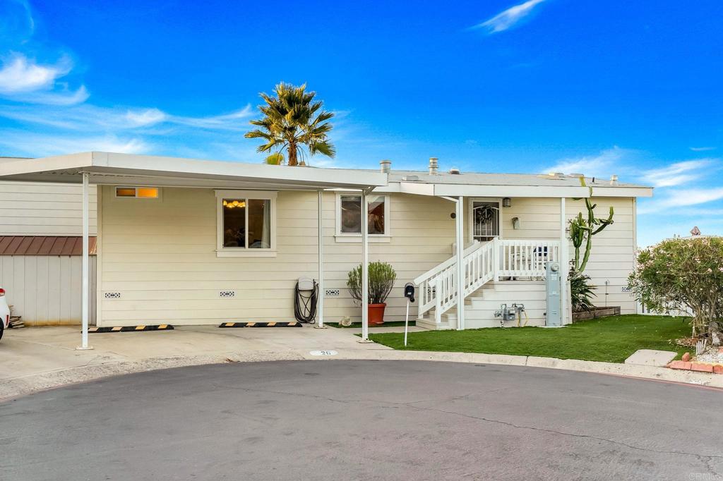 9100 Single Oak Drive, Unit 26 Lakeside, CA 92040 - Photo 45 of 46 a front view of a house with a yard